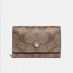 Coach 5-key case in signature canvas.  Brand new!